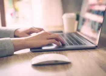 business-woman-using-laptop-computer-online-activity-wood-table-home-office