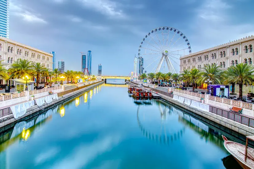 Sharjah Media City with Ferris wheel, representing a business startup in Sharjah